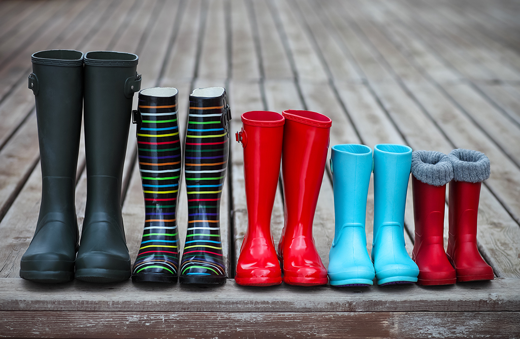 Five pairs of a colorful rain boots. Family concept